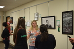 Fall 2018 Art in the Library Reception: Gallery with viewers-4